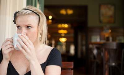 Woman is drinking coffee
